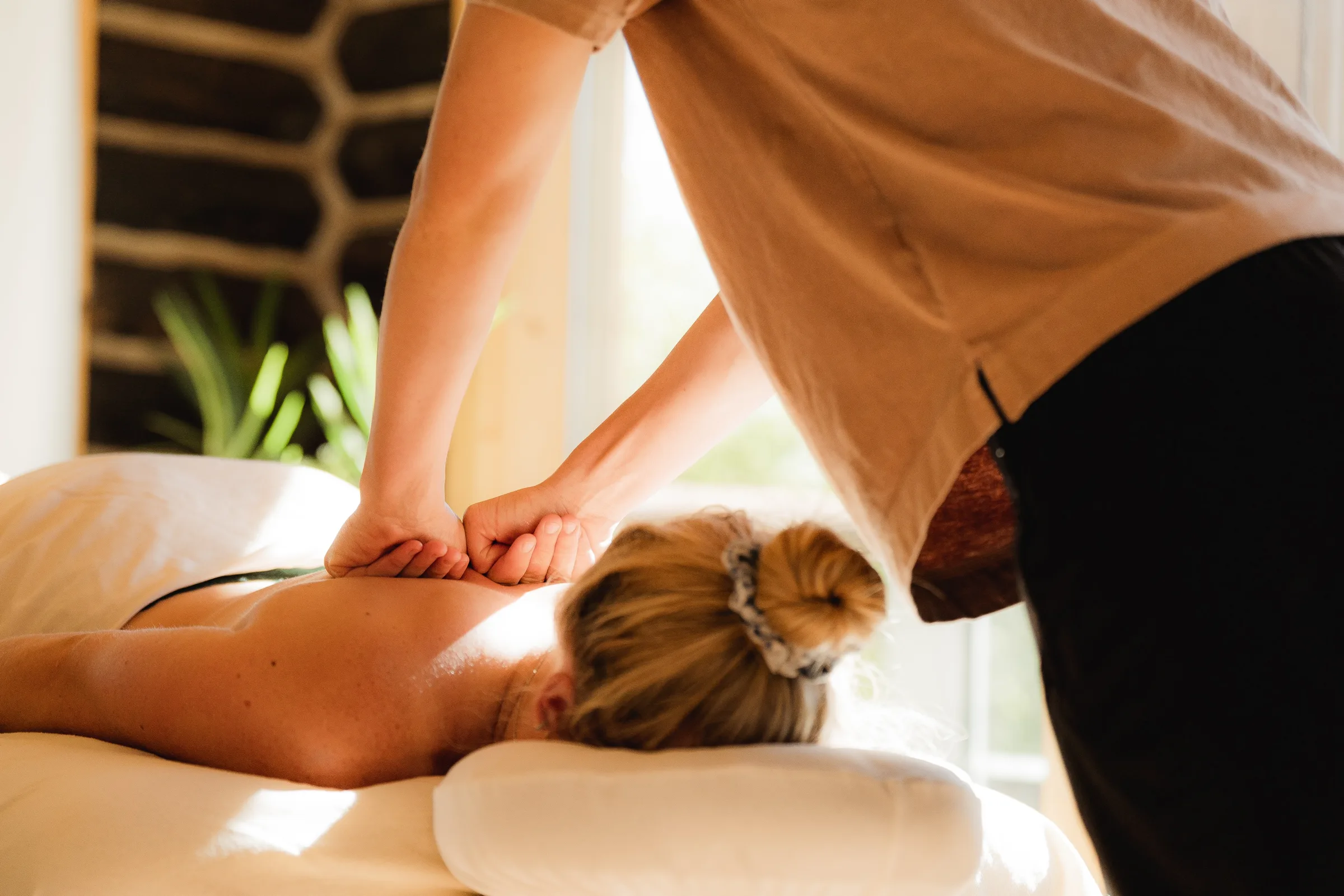 Therapeutic massage session at With Intent spa